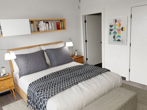 Bedroom with contemporary furnishings at M Station Apartments, a Greystar community offering luxury living in a vibrant neighborhood