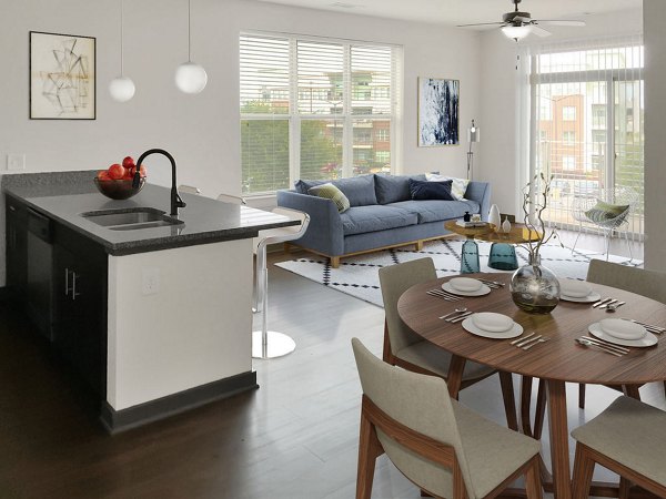 Modern kitchen with stainless steel appliances in M Station Apartments