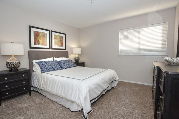 Cozy bedroom with modern decor at Cypress Creek Apartments, Greystar luxury apartments in a vibrant neighborhood