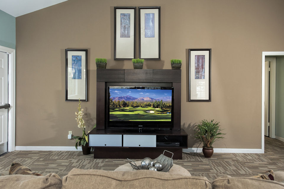 Clubhouse featuring modern design and comfortable seating at Cypress Creek Apartments in a serene wooded setting