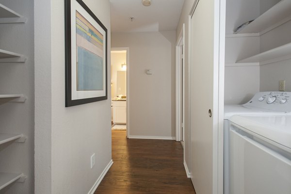 Elegant hallway with modern lighting fixtures at Cypress Creek Apartments