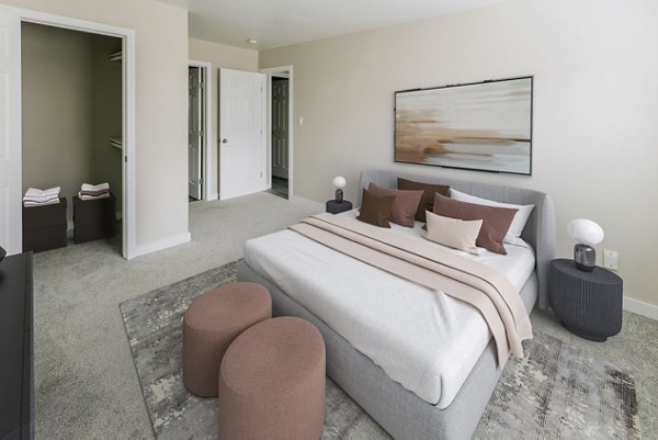 Cozy bedroom featuring elegant decor at Sun River Village Apartments