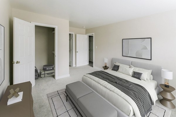 Cozy bedroom with modern furnishings at Sun River Village Apartments, luxury residences by Greystar