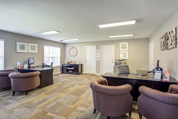 Modern clubhouse with stylish seating and fireplace at Sun River Village Apartments