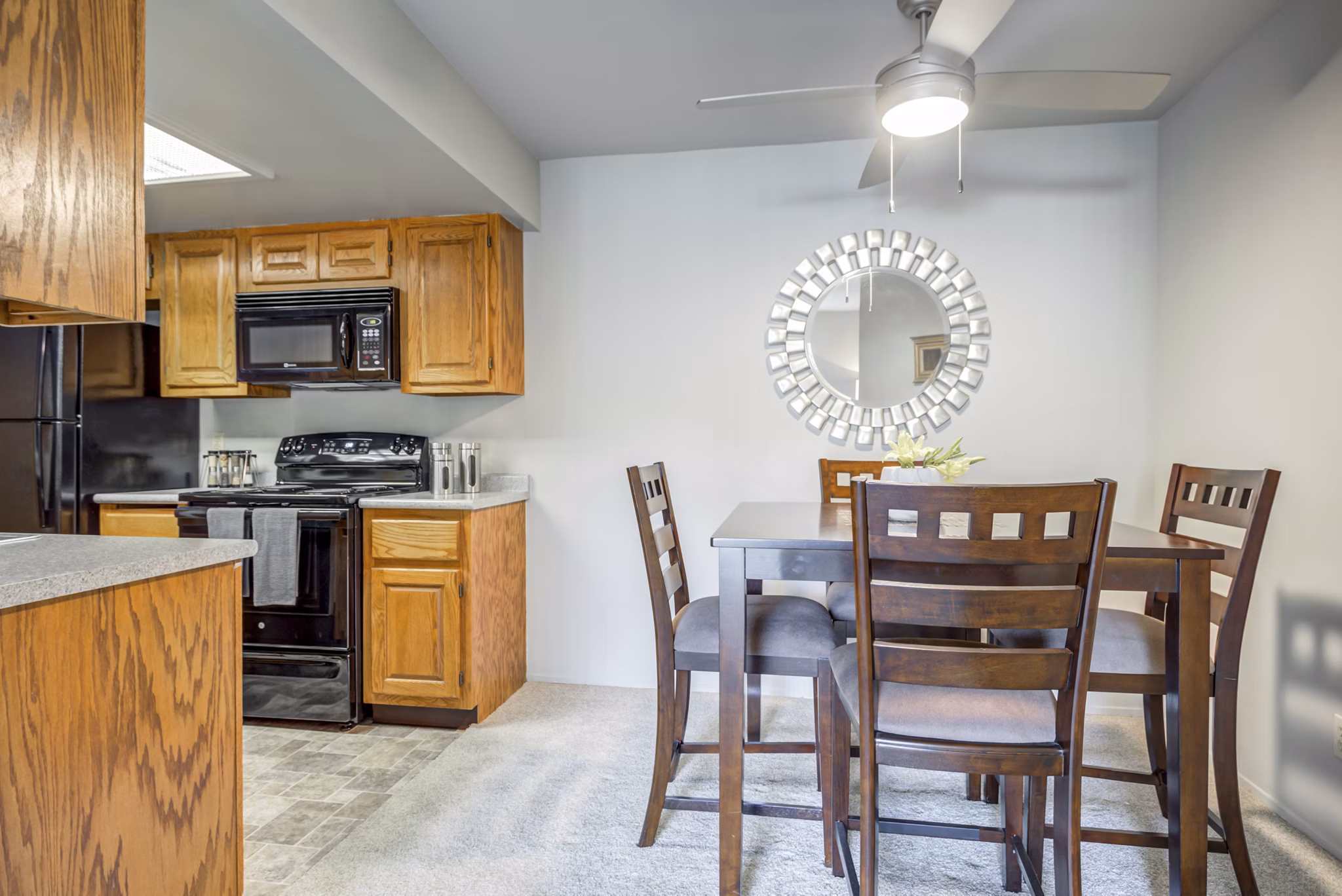 Dining area with modern decor and hardwood flooring at Sun River Village Apartments, ideal for luxury living near local conveniences
