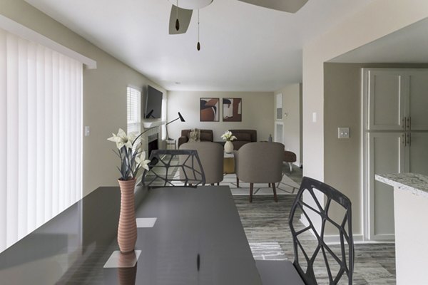 Dining area with elegant furniture and modern lighting at Sun River Village Apartments