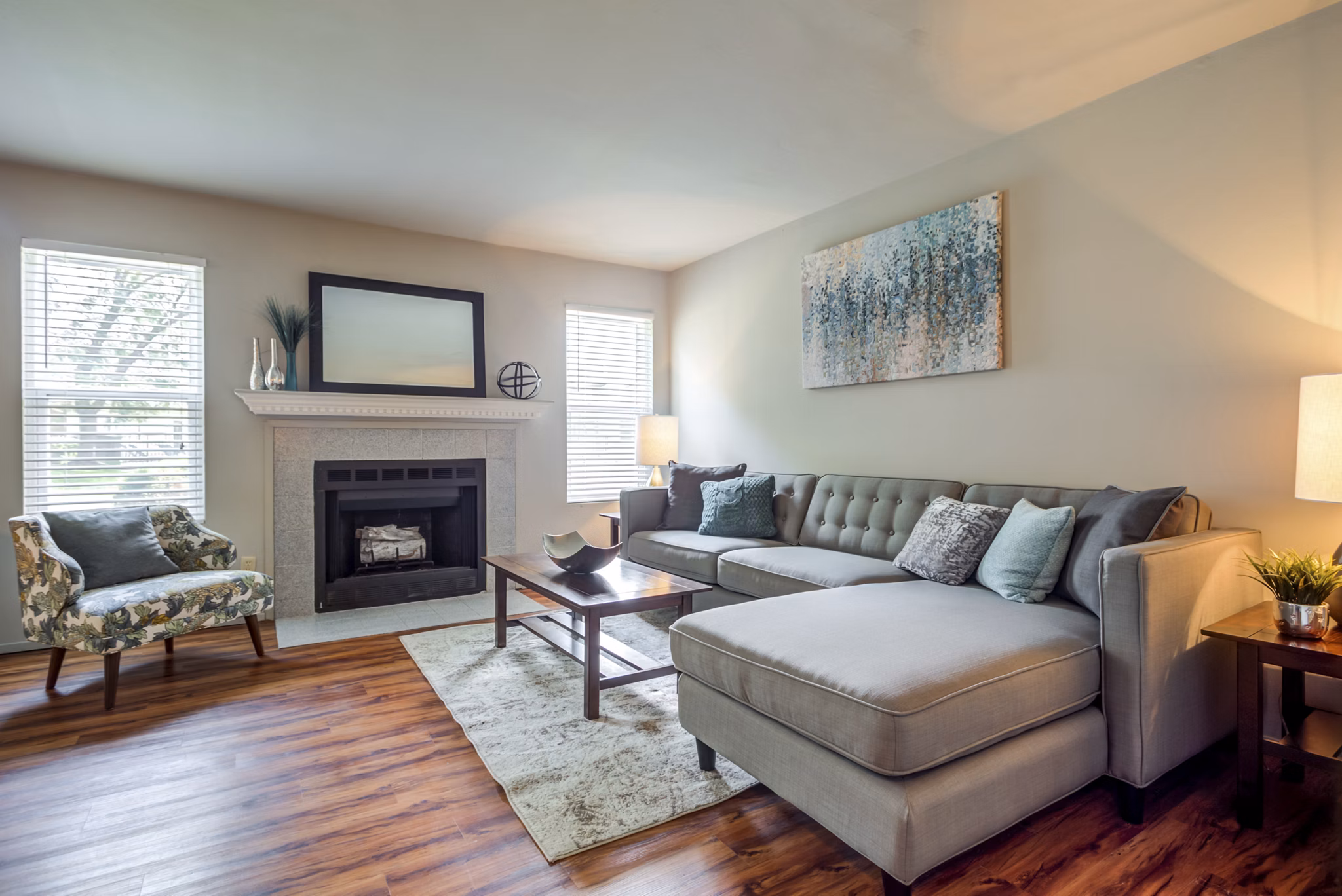 Cozy living room with modern decor and natural light at Sun River Village Apartments