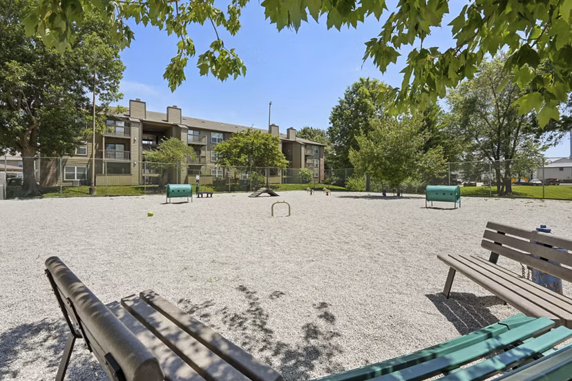 Dog park with agility course features at Sun River Village Apartments