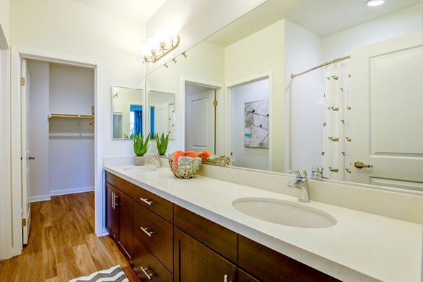 Modern bathroom with elegant fixtures at Encanto Apartments: luxury design in stylish setting