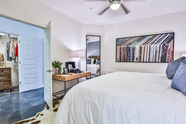 Cozy bedroom with modern decor in Ayla Apartments, luxury living by Greystar