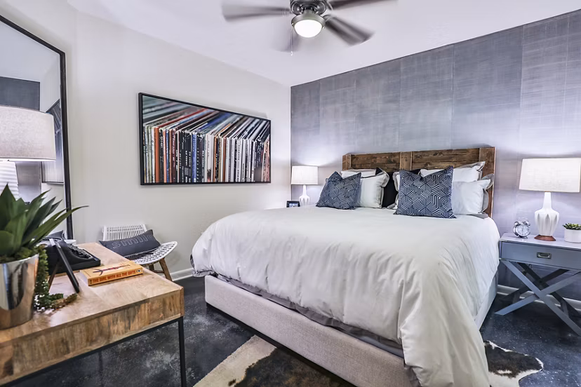 Cozy bedroom with modern decor at Ayla Apartments featuring stylish furnishings and natural light