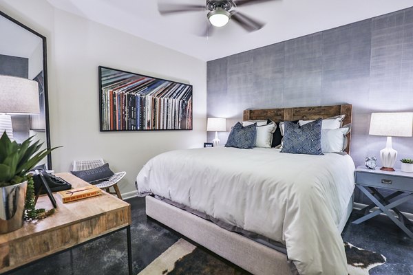 Cozy bedroom with modern decor at Ayla Apartments featuring stylish furnishings and natural light