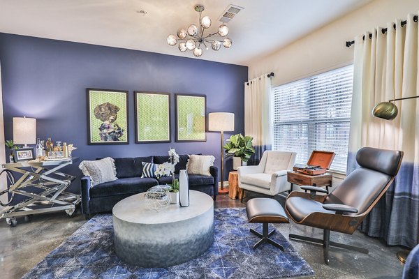 Spacious living room with modern furnishings at Ayla Apartments