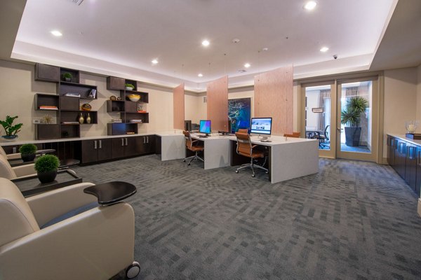 Clubhouse featuring contemporary design elements at Domain West Apartments, ideal for social gatherings and community events