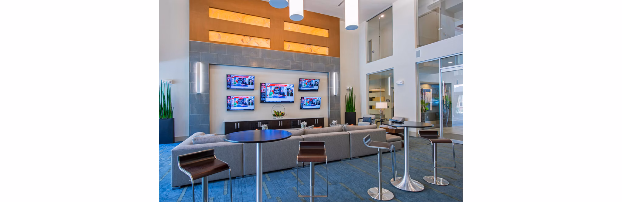 Clubhouse featuring modern design and cozy seating at Domain West Apartments, ideal for social gatherings and relaxation