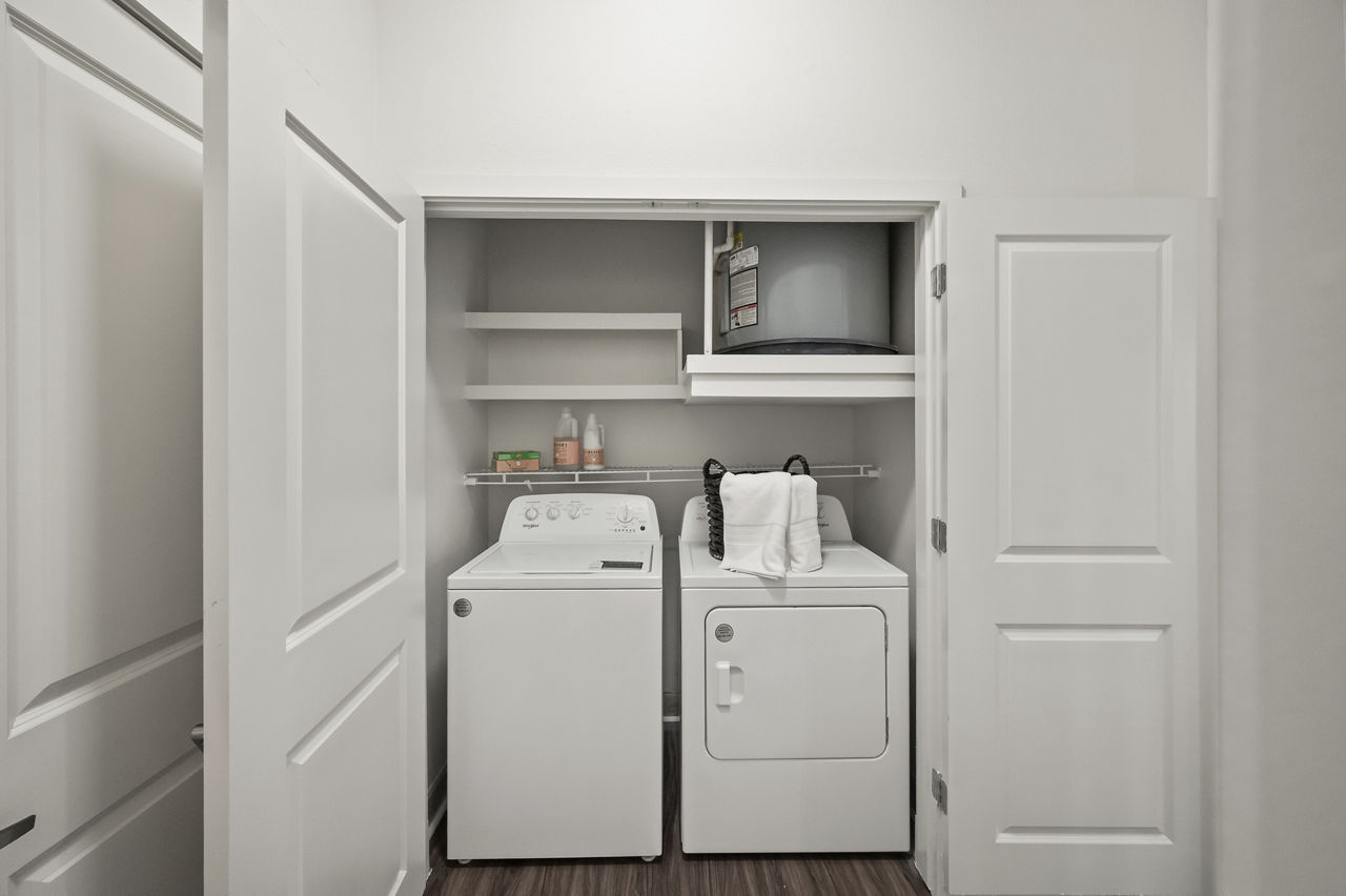 Laundry room at Domain West Apartments