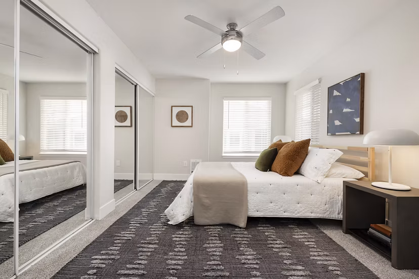 Modern bedroom with elegant decor at Canyon Creek Apartments, a luxury Greystar community