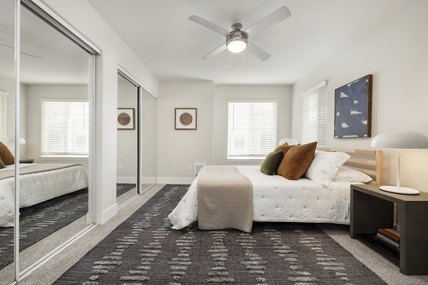 Modern bedroom with elegant decor at Canyon Creek Apartments, a luxury Greystar community