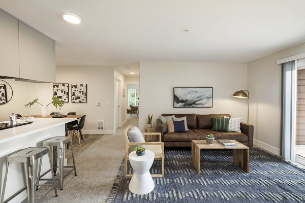 Spacious kitchen with granite countertops and stainless steel appliances at Canyon Creek Apartments