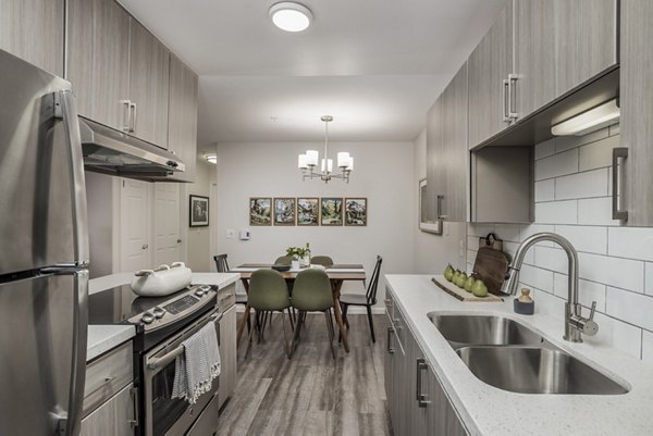 Canyon Creek Apartments: Modern kitchen with stainless steel appliances and granite countertops