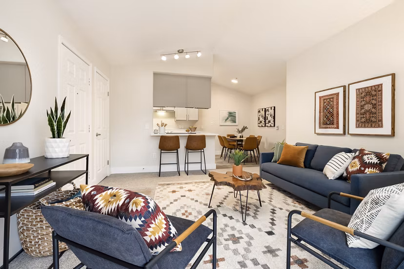 Modern living room and dining area with stylish furniture and decor in luxury apartments