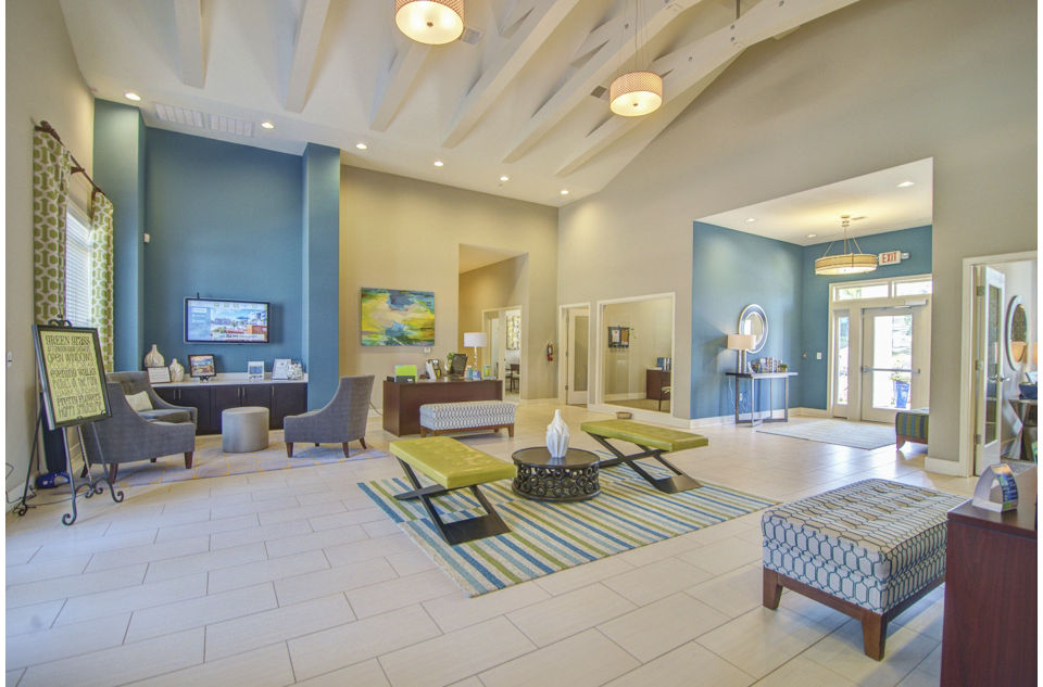 Modern clubhouse with spacious seating and entertainment amenities at Capital Place at Southwood Apartments