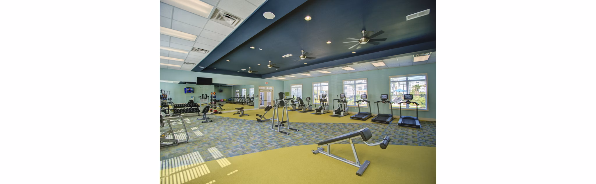 State-of-the-art fitness center at Capital Place at Southwood Apartments featuring modern equipment and spacious workout areas
