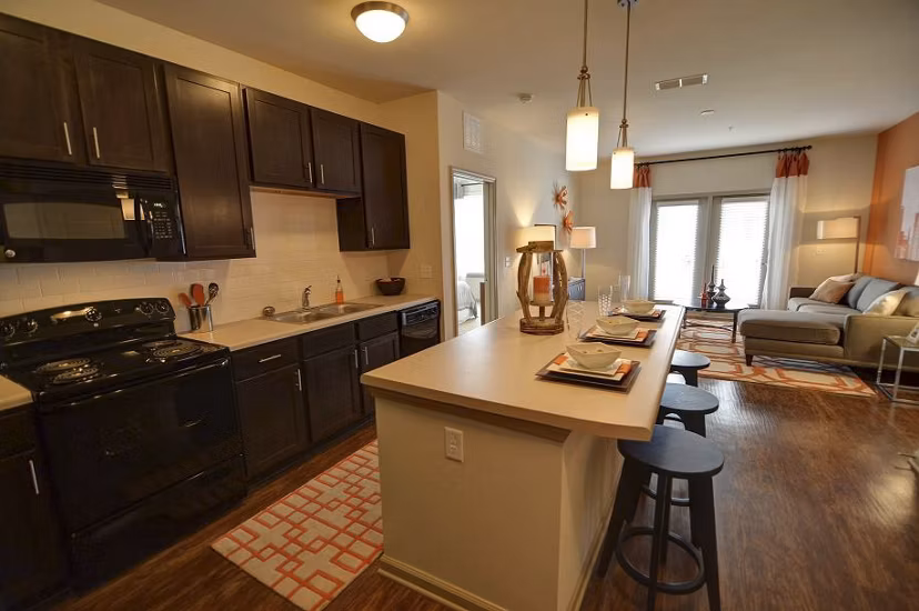 Modern kitchen with stainless steel appliances at Capital Place at Southwood Apartments
