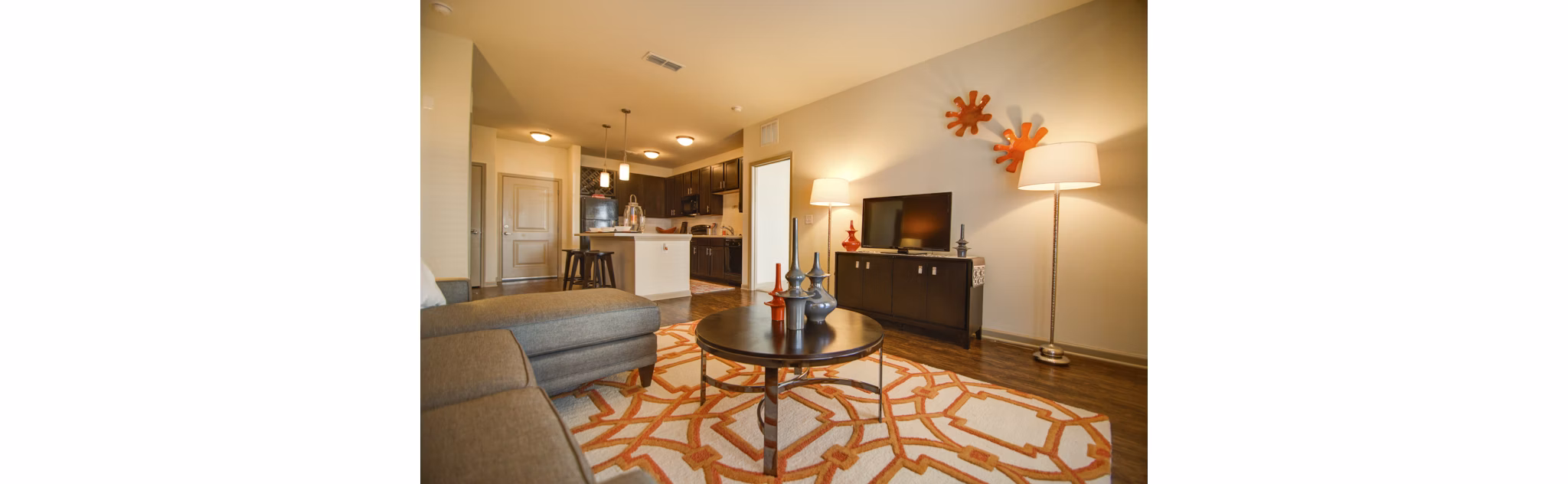 Modern living room with sleek furniture and ample natural light at Capital Place at Southwood Apartments