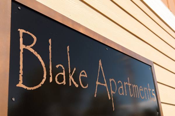 signage at The Blake Apartments