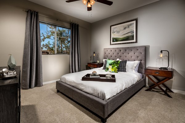 Cozy bedroom with modern decor in Montiavo Apartments