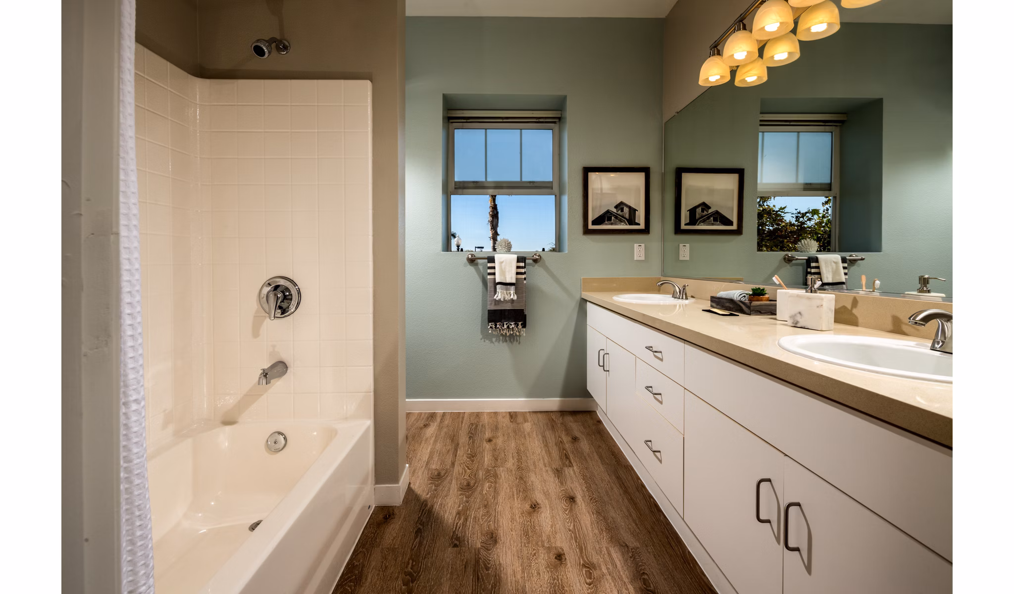 Contemporary bathroom featuring sleek fixtures and ample storage at Montiavo Apartments