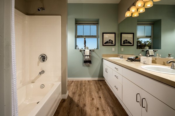 Contemporary bathroom featuring sleek fixtures and ample storage at Montiavo Apartments