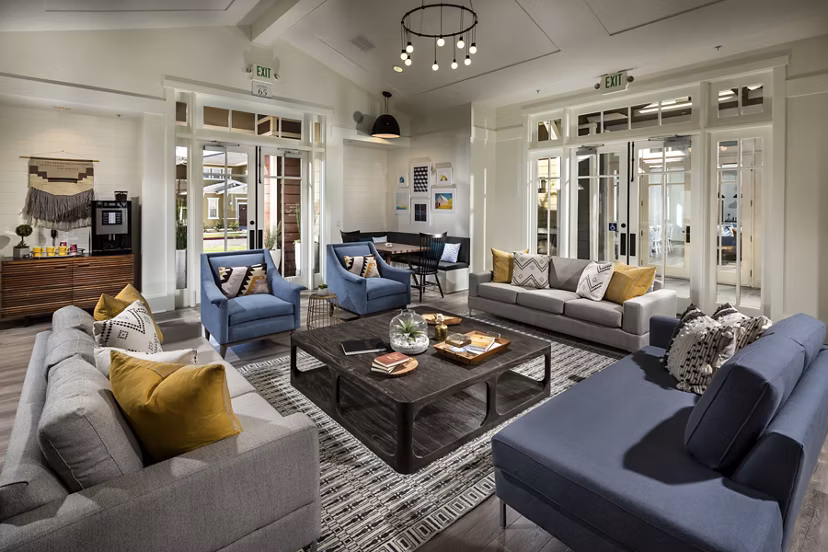 Clubhouse featuring modern design and comfortable seating at Montiavo Apartments, a Greystar luxury community