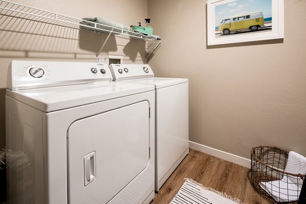 Efficiency-focused laundry room with energy-saving washers and dryers in Montiavo Apartments
