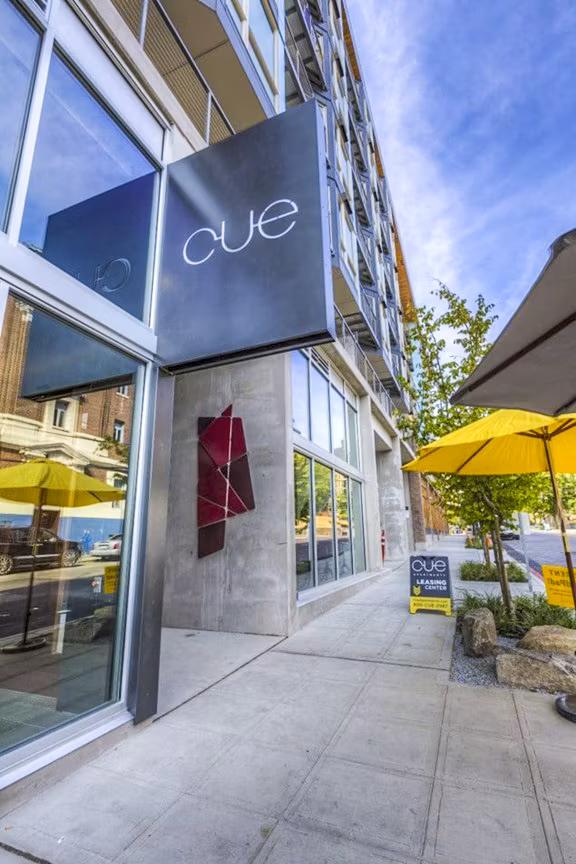 Cue Apartments: Elegant with modern signage in a luxury setting