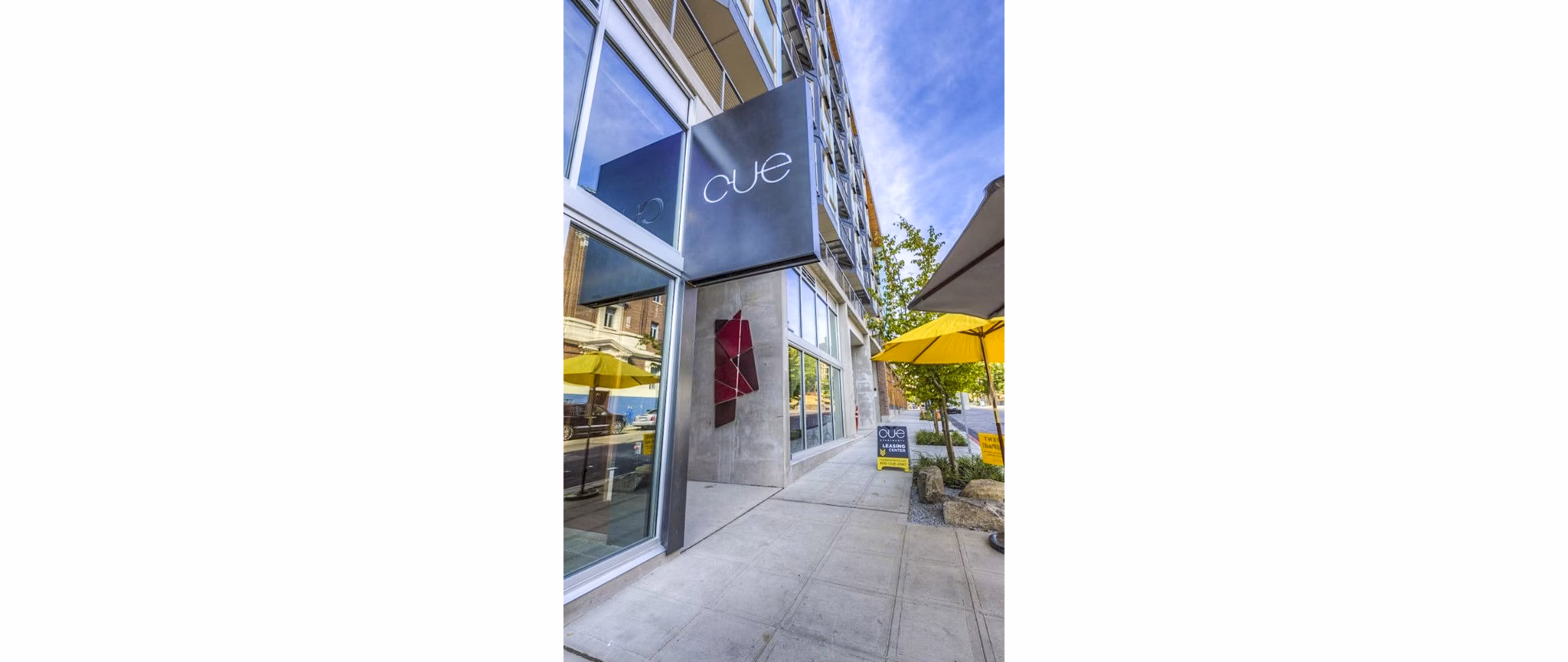 Cue Apartments: Elegant with modern signage in a luxury setting