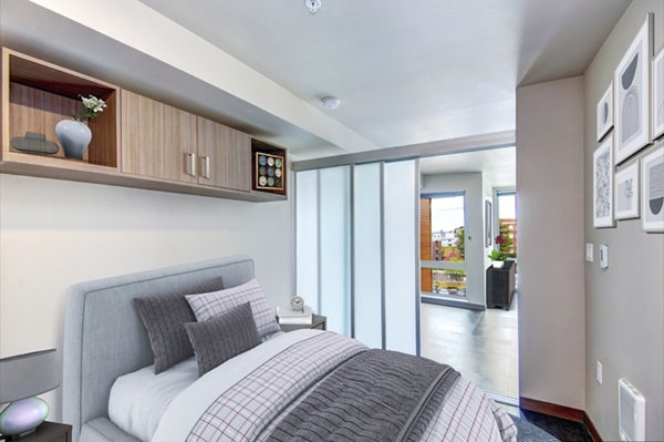 Spacious bedroom with modern decor in Cue Apartment Homes