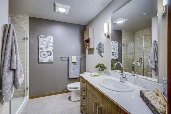 Modern bathroom featuring sleek fixtures at Cue Apartments