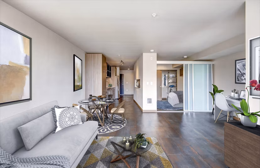Spacious living room with modern furnishings in Cue Apartments