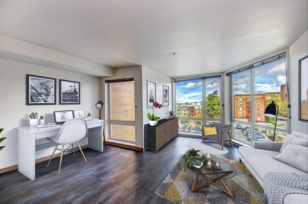 Modern home office and living room with stylish decor at Cue Apartments