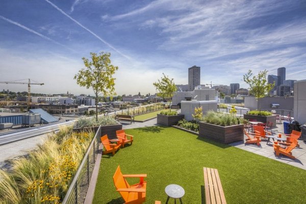 Spacious patio balcony with city view at Cue Apartments