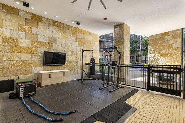 State-of-the-art fitness center featuring modern equipment at The Kenzie at The Domain Apartments