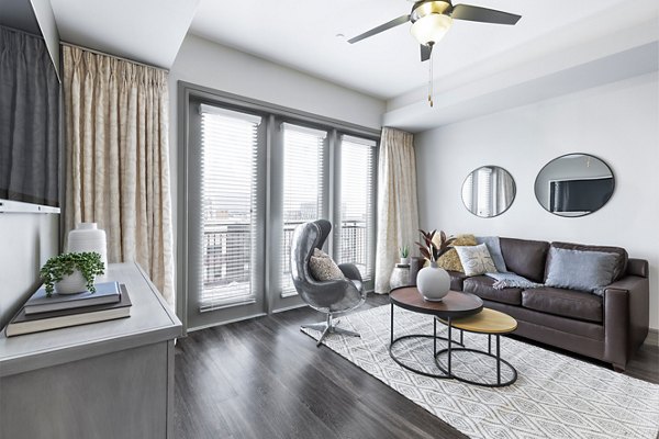 Spacious living room with modern decor at The Kenzie at The Domain Apartments