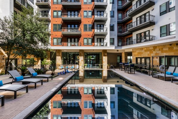 Resort-style pool at The Kenzie at The Domain Apartments offering relaxation and luxury amenities