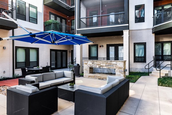 Peaceful courtyard with lush greenery at The Kenzie at The Domain Apartments for luxury outdoor relaxation