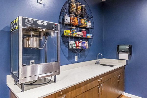 Theater-style concession area with modern decor at Album Quail Springs Apartments, ideal for movie nights and community events