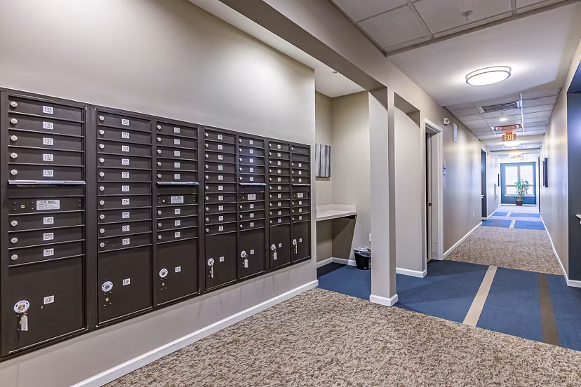 Mail center with secure package lockers at Album Quail Springs Apartments, designed for efficient package management