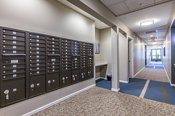 Mail center with secure package lockers at Album Quail Springs Apartments, designed for efficient package management