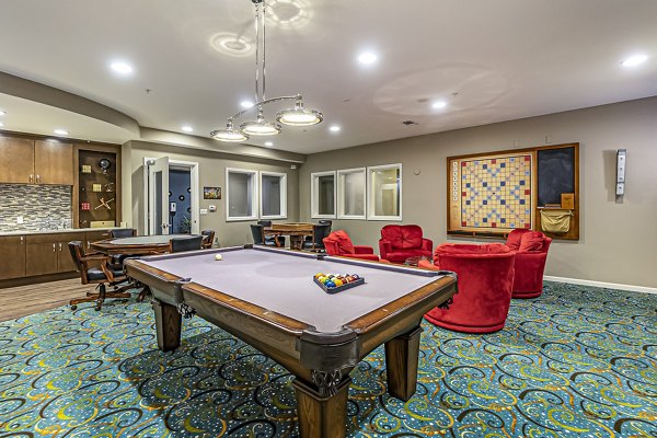 Modern game room with billiards and seating at Album Quail Springs Apartments, offering luxury lifestyle amenities for residents